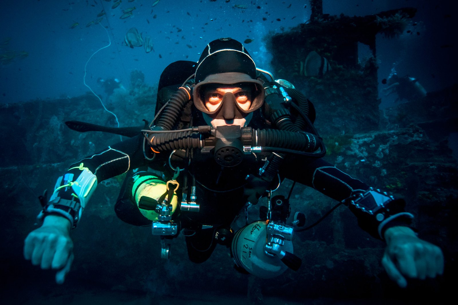 Underwater portrait of technical diver using a rebreather device to locate shipwreck, Lombok, Indonesia